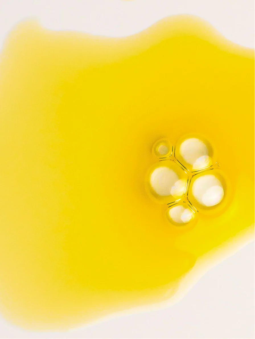 Yellow gel with bubbles on a white background
